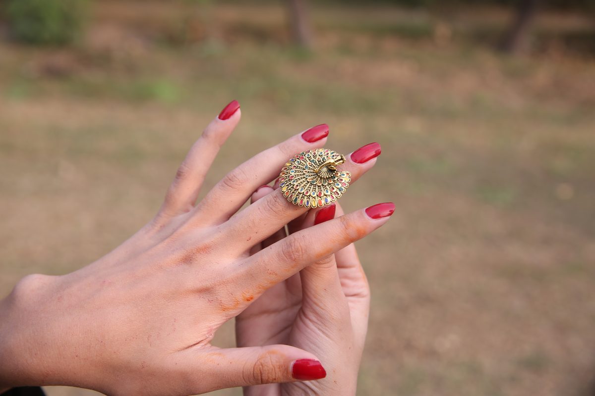 Golden ring with peacock design