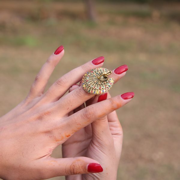 Golden ring with peacock design